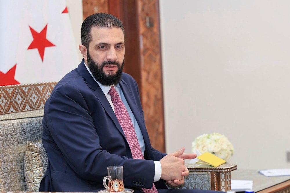 Syria's interim President Ahmad al-Sharaa receives the final version of the provisional electoral system for the People's Assembly, in Damascus, Syria, Sunday, July 27, 2025 (SANA)