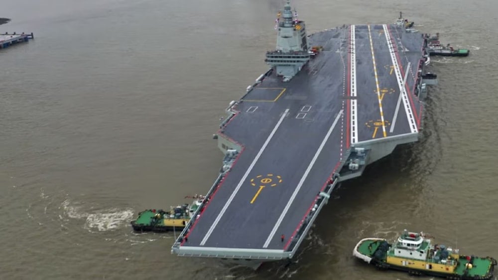 An undated photo of China's third aircraft carrier, the Fujian, preparing to set out for maiden sea trials from Shanghai Jiangnan Shipyard in eastern China's Shanghai. (AP)