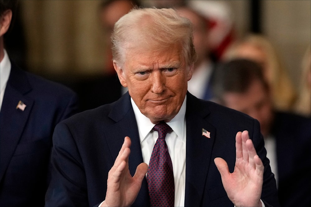 US President Donald Trump gestures during the 60th Presidential Inauguration in the Rotunda of the US Capitol in Washington, Monday, January 20, 2025. (AP Photo/Julia Demaree Nikhinson, Pool)