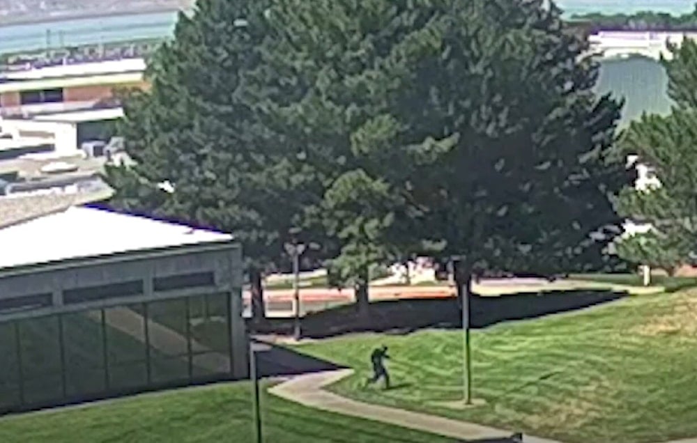 Screencap from footage released by the FBI documenting the moment Charlie Kirk's assassin fleeing the Utah Valley University campus (FBI)