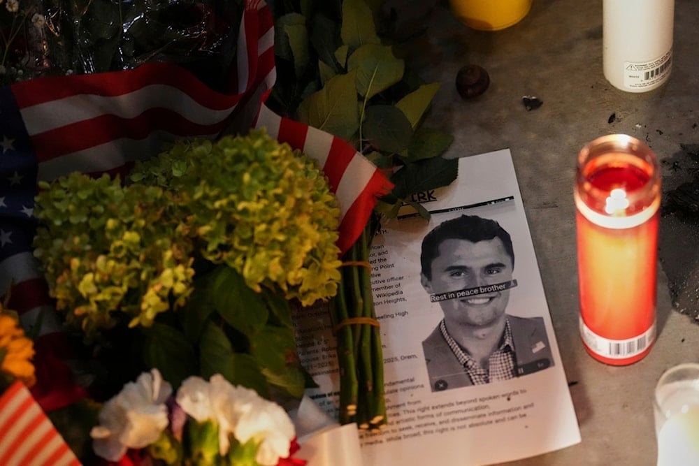 A photo of Charlie Kirk, the CEO and co-founder of Turning Point USA, who was shot and killed, sits at a vigil in his memory, Thursday, September 11, 2025, in Orem, Utah (AP)