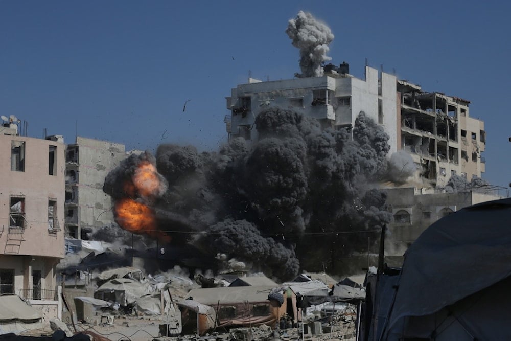 Smoke and flames rise after an Israeli military strike on a building in Gaza City, Friday, September 12, 2025 (AP)