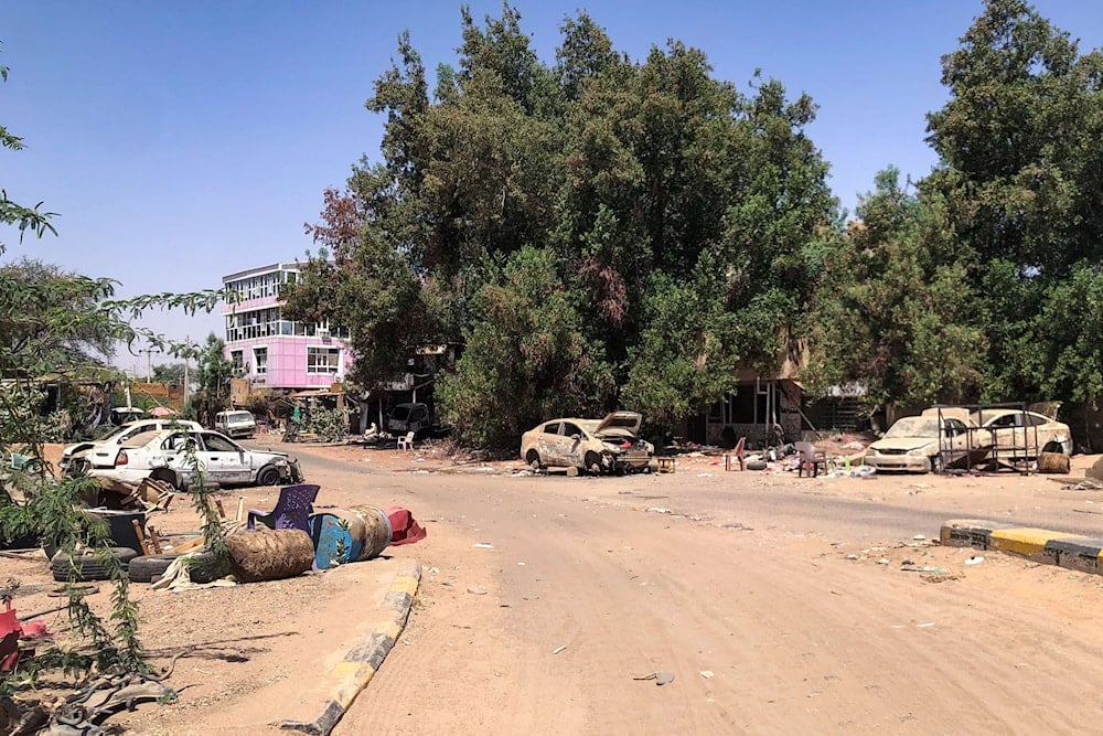 Damaged cars lie in a deserted street in Sudan's Tuti island, nearly deserted after two years of war between the Sudanese army and the paramilitary Rapid Support Forces (RSF),on April 19, 2025. (AFP)
