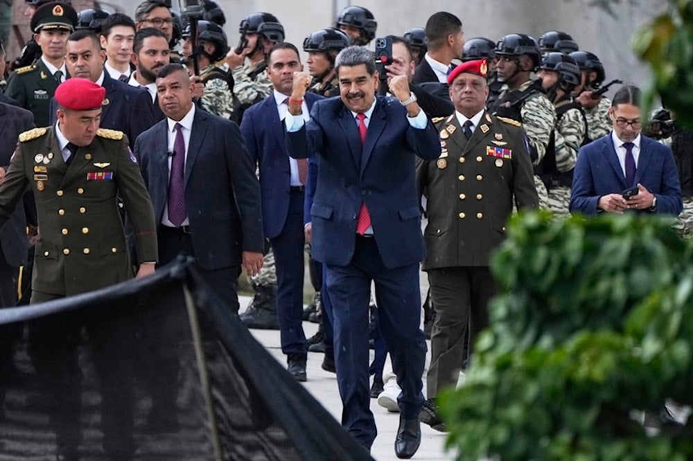 President Nicolas Maduro gestures to supporters during the inauguration of a monument in China's honor on the 80th anniversary of the end of World War II, in Caracas, Venezuela, Wednesday, September 3, 2025 (AP)