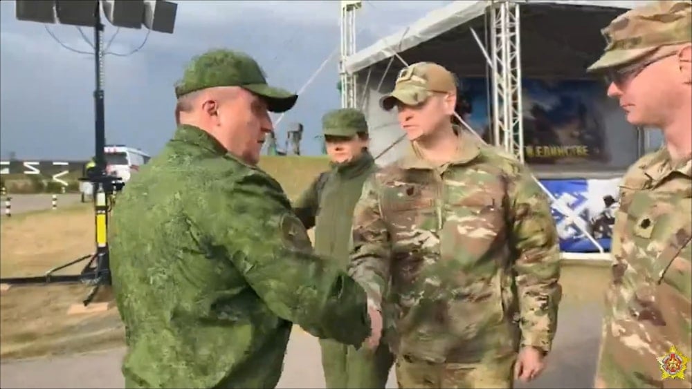 Belarusian Defense Minister Viktor Khrenin greets US military attaché Bryan Shoupe during the Zapad joint drills in Barysaw, Belarus.