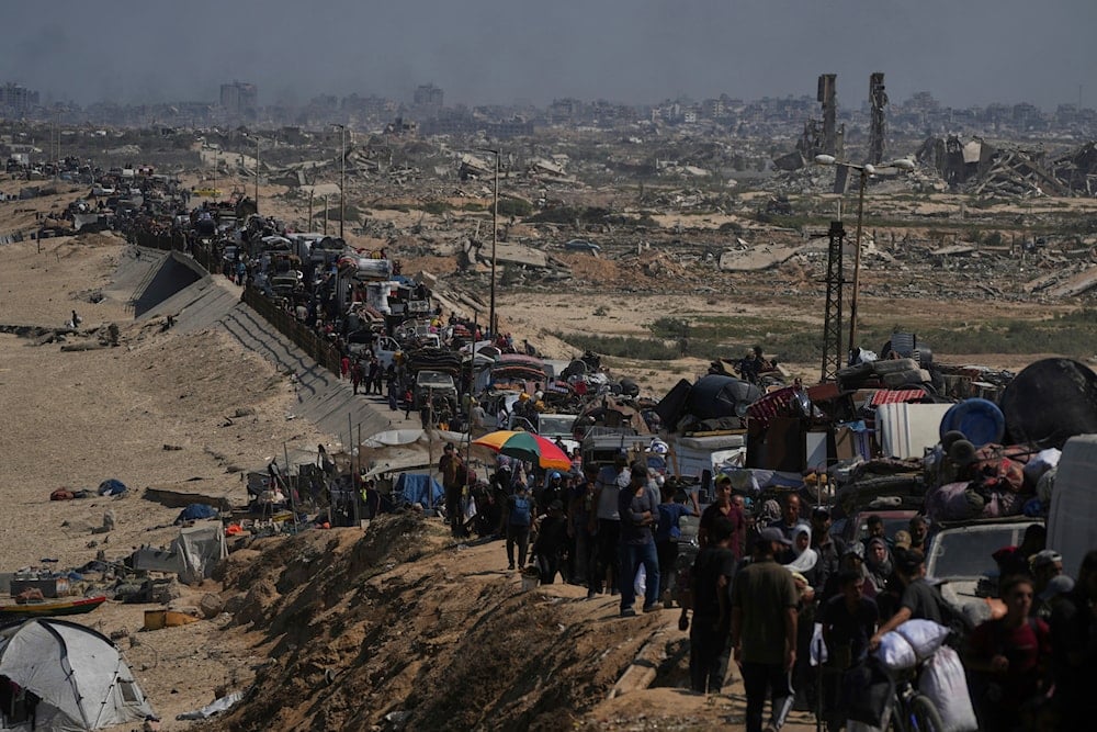 Displaced Palestinians flee northern Gaza along the coastal road toward the south, Tuesday, Sept. 16, 2025 (AP)