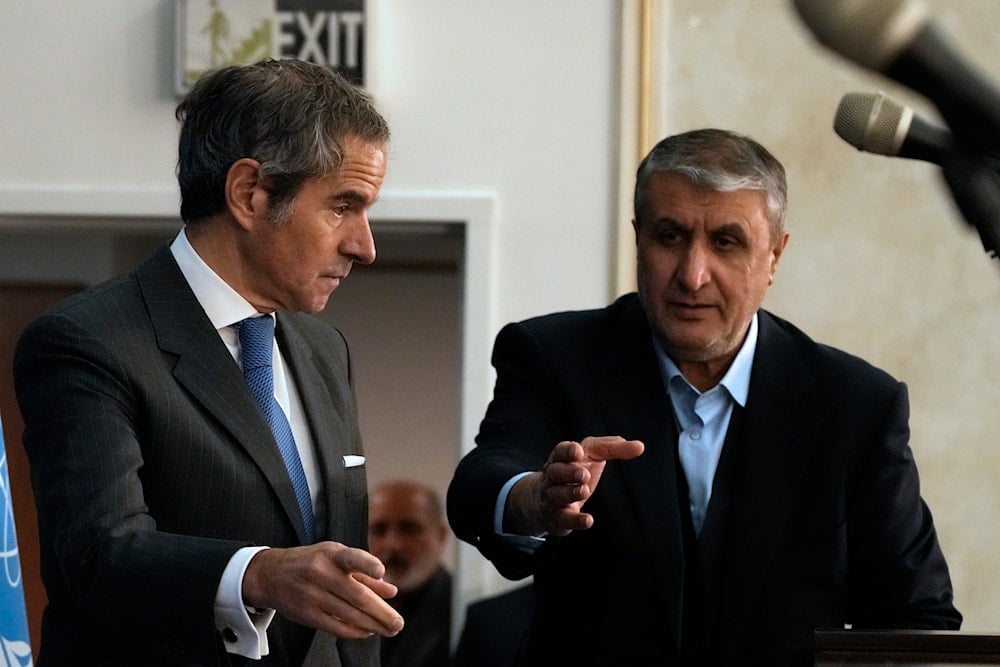 International Atomic Energy Agency, IAEA, Director General Rafael Grossi, and head of Atomic Energy Organization of Iran Mohammad Eslami gesture as they arrive for a press conference in Tehran, Iran, Thursday, Nov. 14, 2024 (AP)