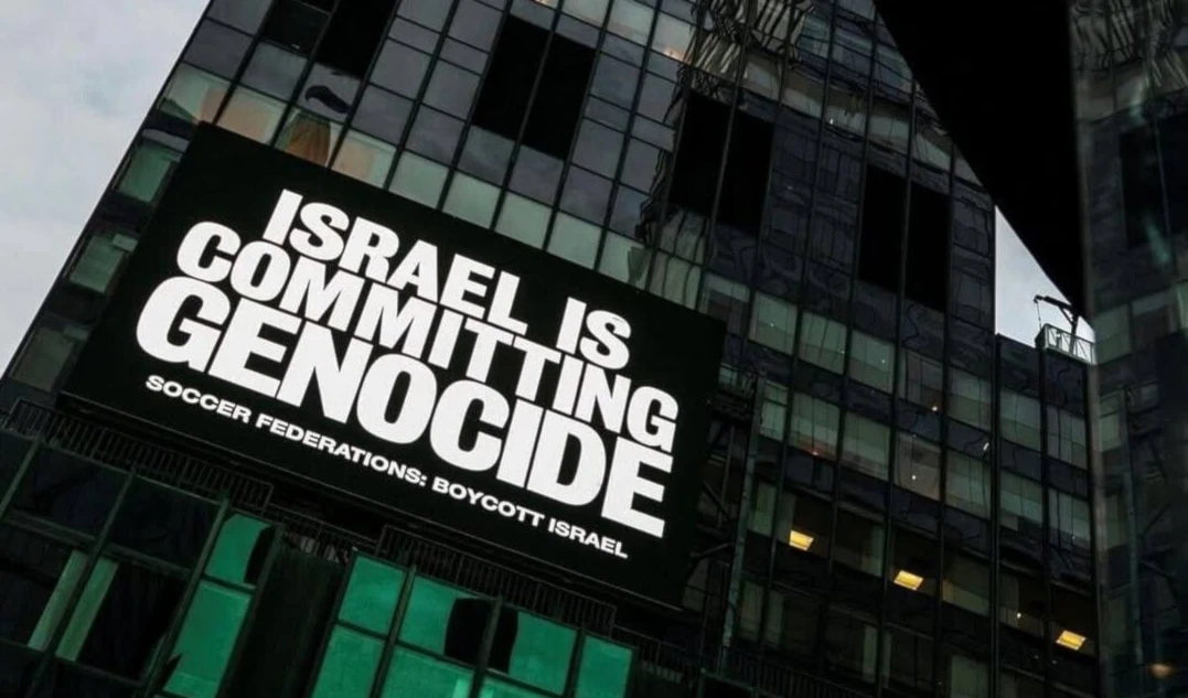 A billboard calling for a boycott of 'Israel' in international football as seen on a building in Times Square, New York City, United States, September 17, 2025 (social media)