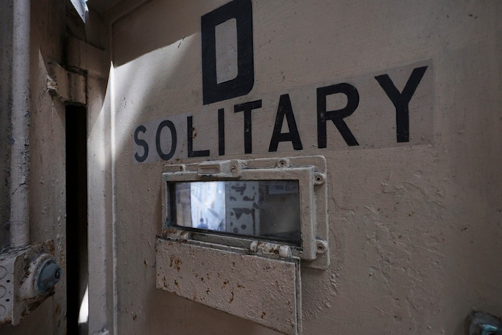 The door to a solitary confinement cell is shown on Alcatraz Island Monday, May 5, 2025, in San Francisco. (AP Photo/Jed Jacobsohn)