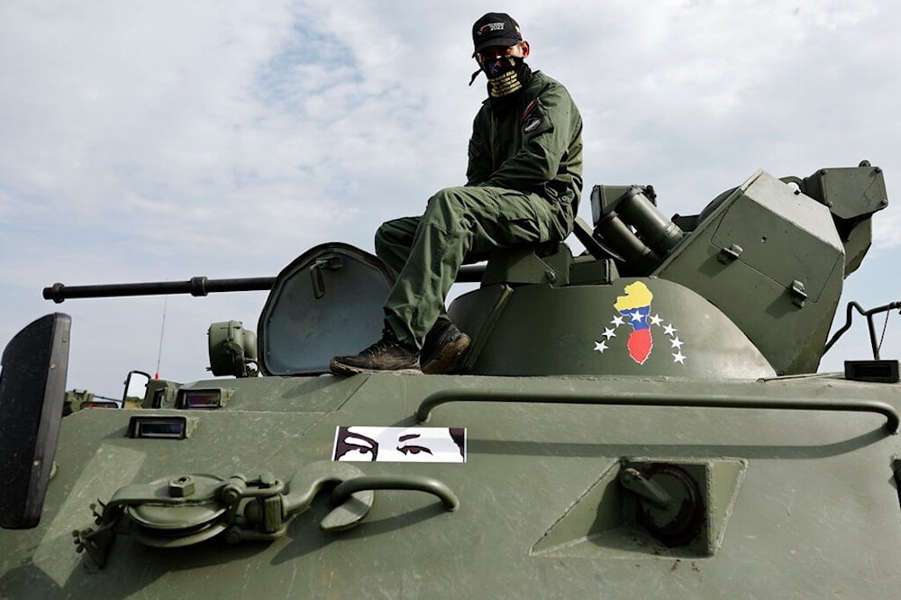 A serviceman of Venezuela's army on an armoured personnel carrier BTR-82A takes part in the 2022 International Army Games in Russia's Baltic exclave of Kaliningrad, Russia, Wednesday, August 24, 2022 (AP)