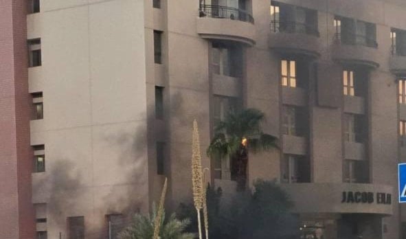 Smoke rises after a Yemeni drone hit Naveh Hotel in Eilat, occupied Palestine, September 18, 2025 (Social Media)