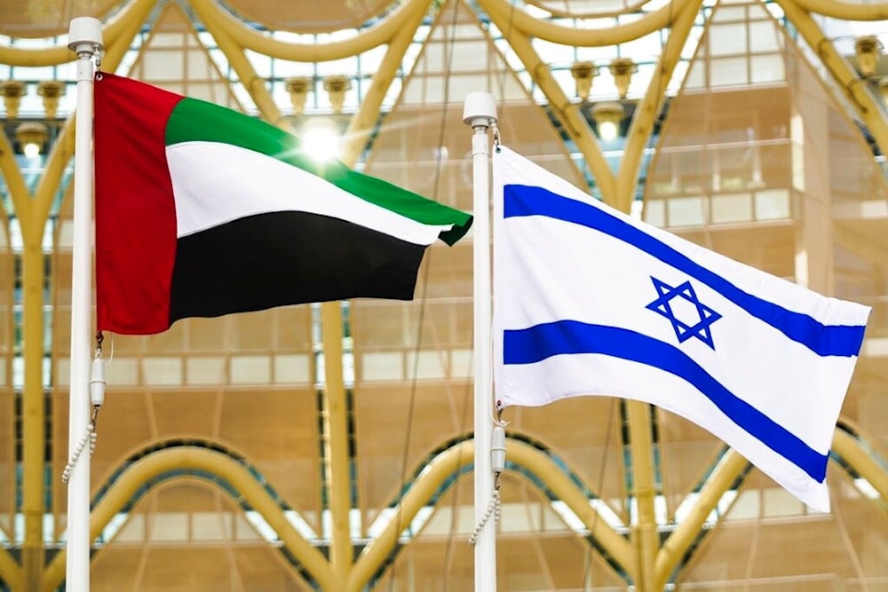 The Emirati and Israeli flags fly overhead as Israeli President Isaac Herzog gives a speech at Expo 2020 in Dubai, United Arab Emirates, Monday, Jan. 31, 2022. (AP)