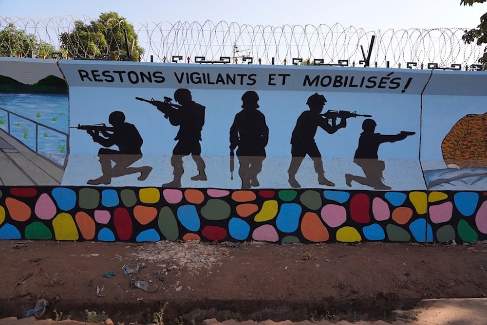 FILE - A mural reading 