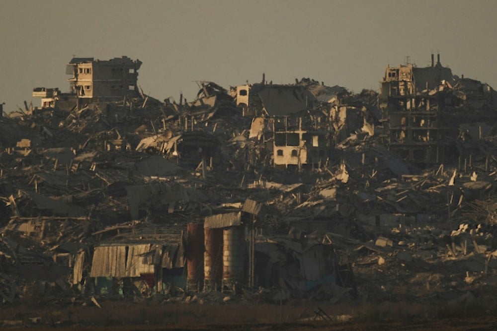 Buildings that were destroyed during the Israeli ground and air operations stand in the northern Gaza Strip during the sunset as seen from southern occupied Palestine, Tuesday, September 16, 2025 (AP)