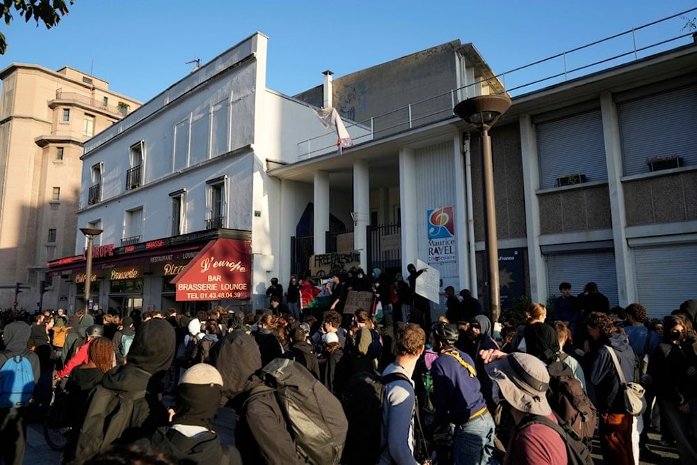 Students block the entrance of a school during a protest called by major trade unions to oppose budget cuts, in Paris, France, Thursday, September 18, 2025 (AP)