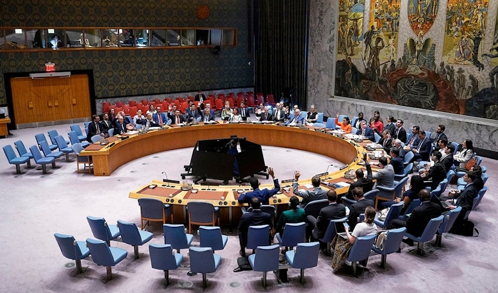 The United Nations Security Council votes on a resolution, during a meeting, Monday, June 30, 2025. (AP Photo/Richard Drew)