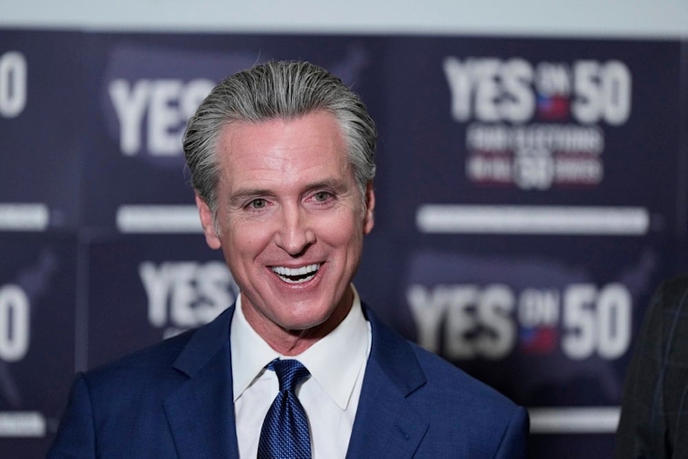 California Gov. Gavin Newsom answers questions after signing legislation calling for a special election on a redrawn congressional map on Thursday, August 21, 2025, in Sacramento, Calif. (AP Photo/Godofredo A. Vásquez)