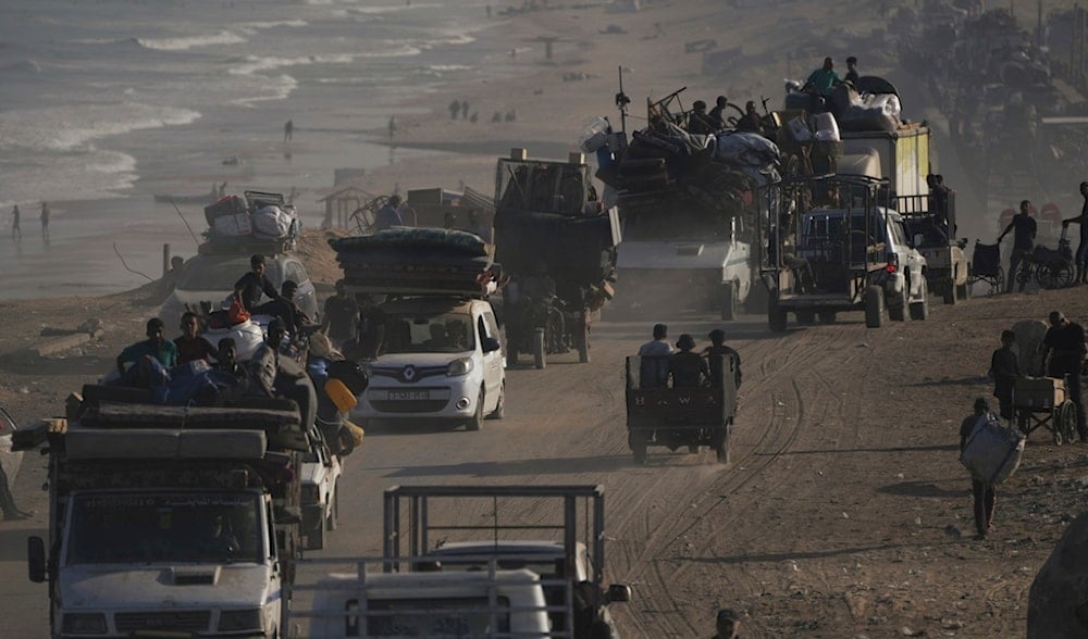 Displaced Palestinians flee Gaza City by foot and vehicles, carrying their belongings along the coastal road toward southern Gaza, Wednesday, Sept. 17, 2025. (AP)