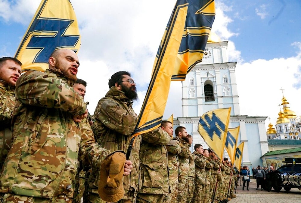  Ukrainian volunteers with the right-wing paramilitary Azov National Corps with their flags demonstrate their force, during Ukrainian Volunteer Day in Kyiv, Ukraine, on March 14, 2020.