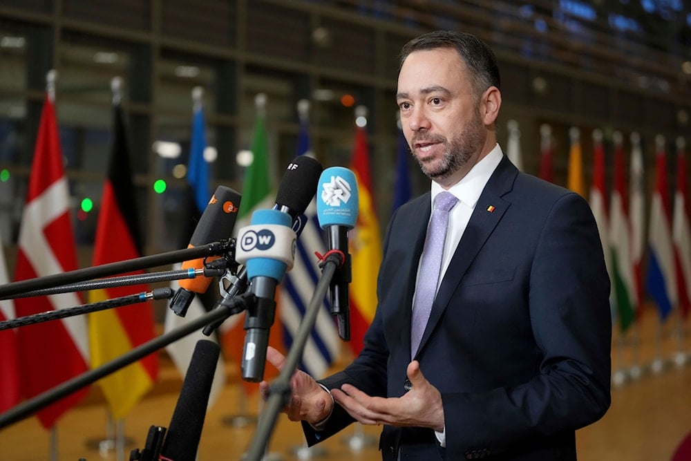 Belgium's Foreign Minister Maxime Prevot speaks with the media as he arrives for a meeting of EU foreign ministers at the European Council building in Brussels, Monday, Feb. 24, 2025 (AP)