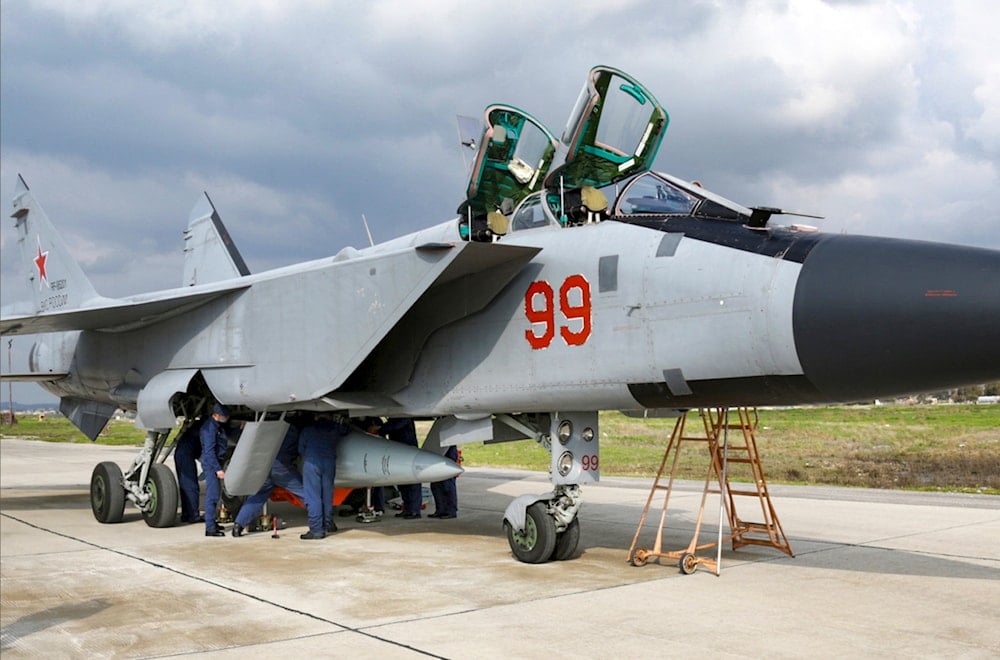 An MiG-31 fighter of the Russian air force carrying a Kinzhal hypersonic cruise missile is parked at the Hemeimeem air base in Syria, February 15, 2022 (AP)