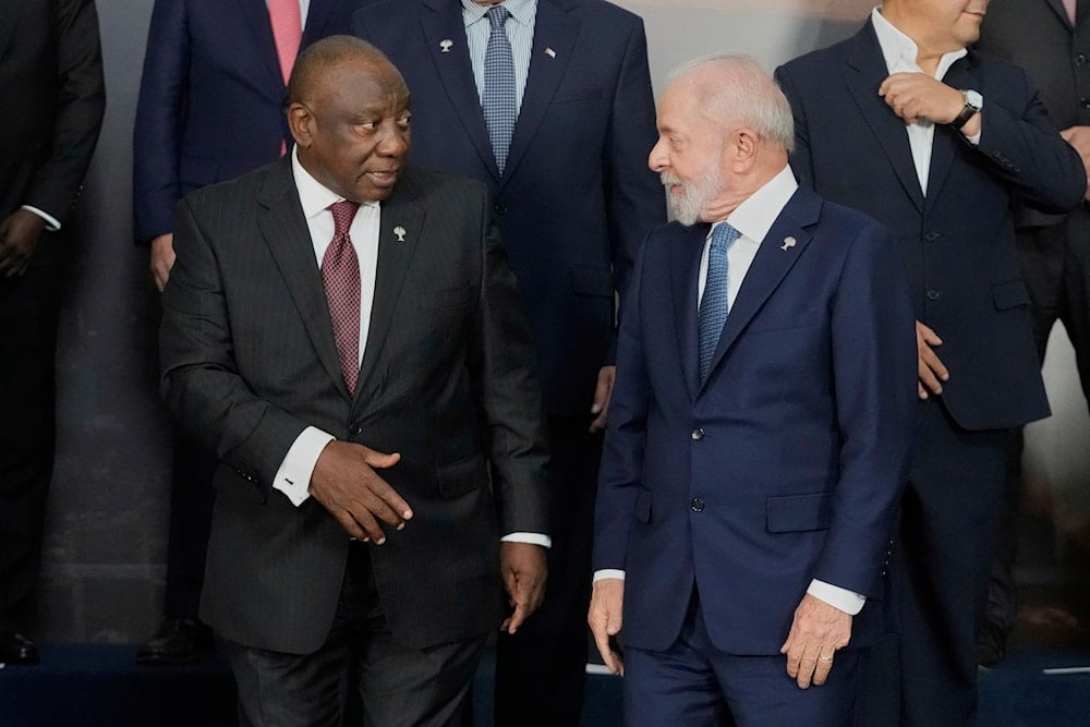 outh Africa's President Cyril Ramaphosa, left, greets Brazilian President Luiz Inacio Lula da Silva, prior to a group photo during the 17th annual BRICS summit in Rio de Janeiro, Monday, July 7, 2025 (AP)