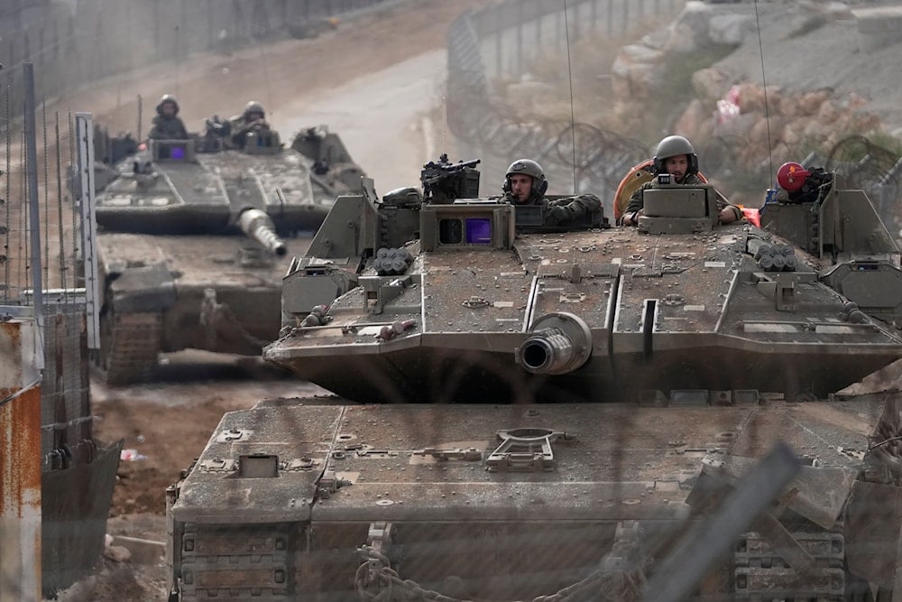 Israeli army tanks maneuver near the so-called Alpha Line that separates the Israeli-occupied Golan Heights from Syria, in the town of Majdal Shams, Wednesday, Dec. 11, 2024 (AP)