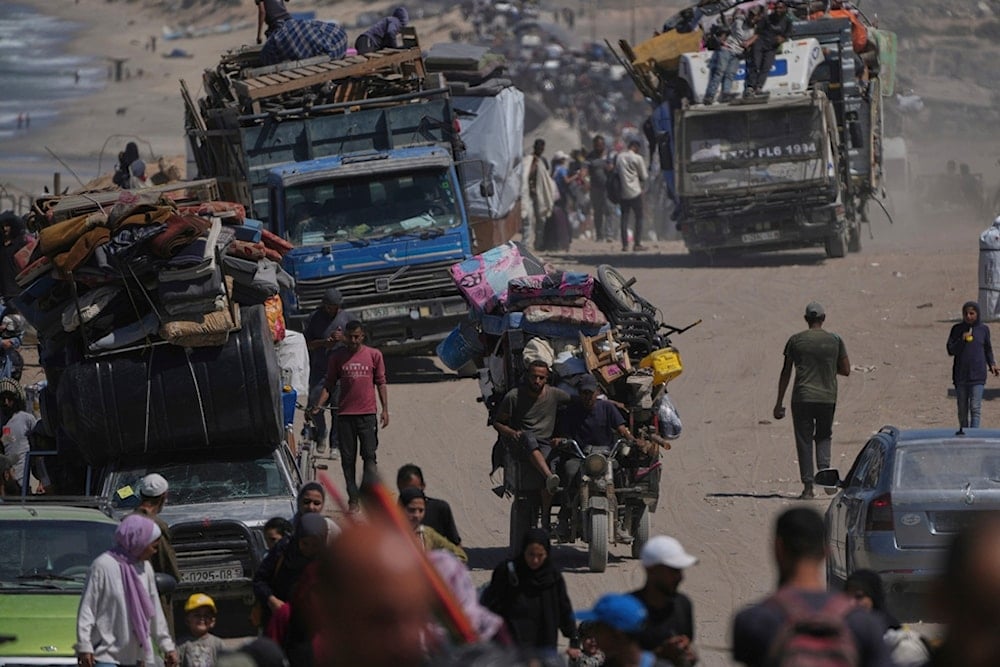 Displaced Palestinians flee northern Gaza Strip, by foot and in vehicles, carrying their belongings along the coastal road, near Wadi Gaza, Saturday, September 20, 2025. (AP Photo/Abdel Kareem Hana)