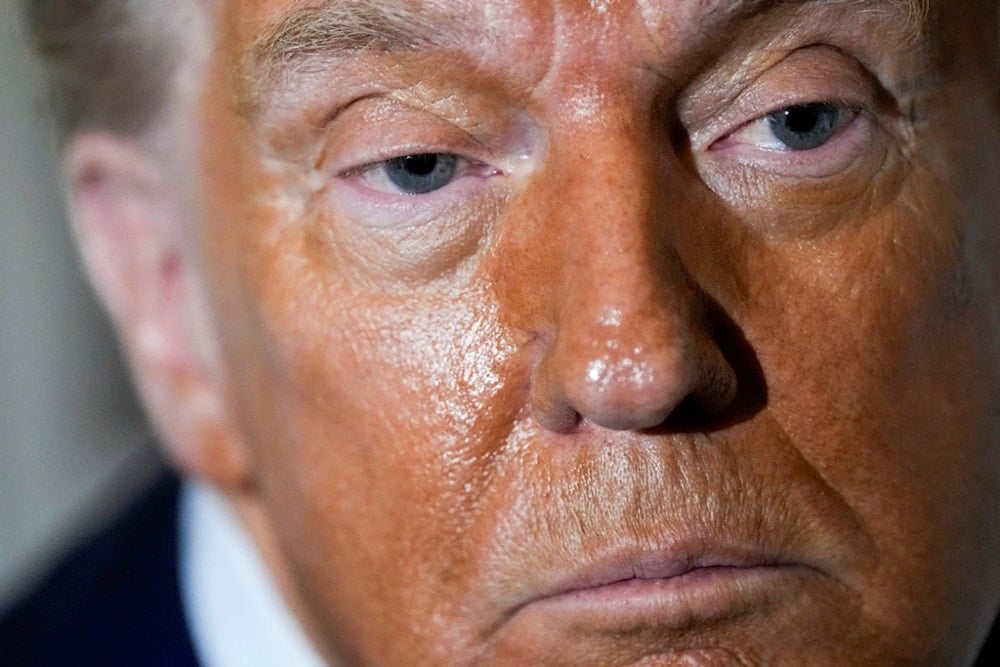 President Donald Trump speaks to reporters aboard Air Force One while en route to Joint Base Andrews, Md. after attending a memorial for conservative activist Charlie Kirk in Glendale, Ariz., Sunday, September 21, 2025. (AP Photo/Julia Demaree Nikhinson)