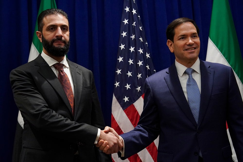 Secretary of State Marco Rubio shakes hands with Syrian interim President Ahmad al-Sharaa at the Lotte New York Palace Hotel, on the sidelines of the 80th United Nations General Assembly at the United Nations headquarters, Monday, Sept. 22, 2025 (AP)