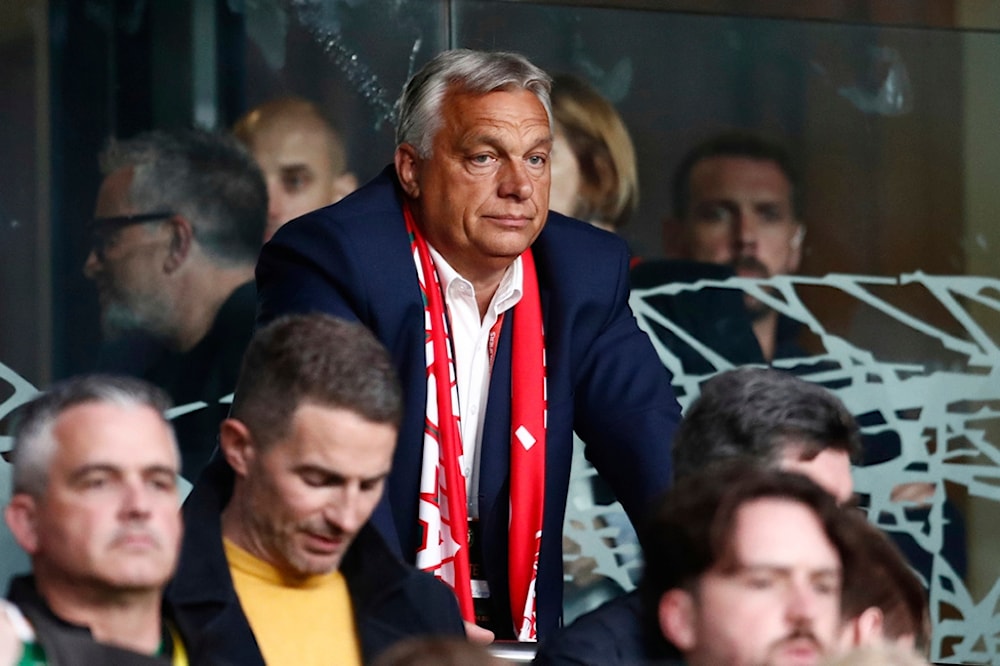 Hungary Prime Minister Viktor Orban, center, on the tribune during a World Cup 2026 group F qualifying soccer match between Ireland and Hungary at the Aviva stadium in Dublin, Saturday, September 6, 2025. (AP Photo/Peter Morrison)