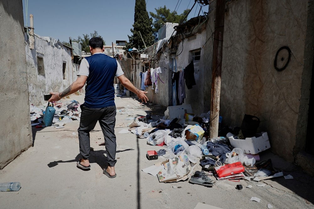 Alawite man walks at an alley in Sumariya, a suburb northwest of Damascus, Syria, Saturday, Aug. 30, 2025 (AP)