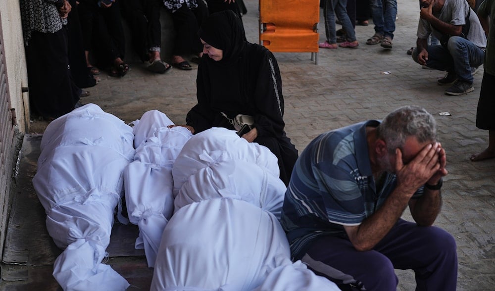 Palestinians mourn during the funeral of people killed in an Israeli strike, outside Al-Aqsa Hospital in Deir al-Balah, central Gaza Strip, Wednesday, Sept. 24, 2025. (AP)