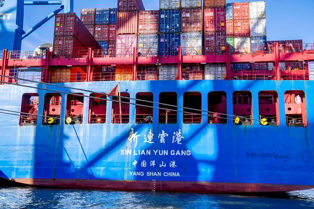 A container ship of Chinese Cosco shipping lies in the harbor in Hamburg, Germany, Wednesday, October 26, 2022 (AP Photo/Michael Probst)
