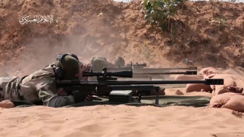 A Palestinian sniper in an undisclosed location in the Gaza Strip in an undated screengrab taken from Al-Qassam Brigades Military Media