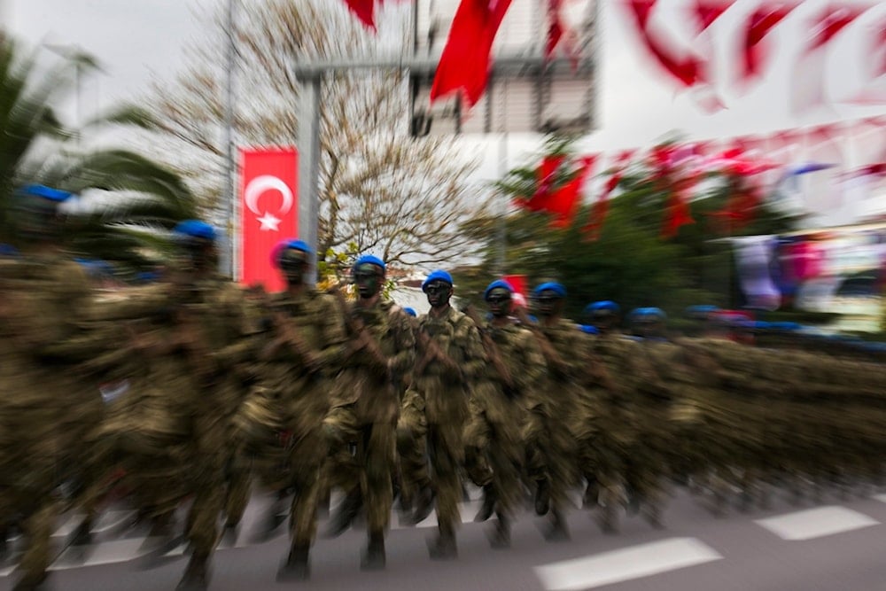 Turkey's Forces officers parade for Victory Day, in Istanbul, Friday, August 30, 2024. Friday's events commemorate the 102nd anniversary of Victory Day, (AP Photo/Khalil Hamra)