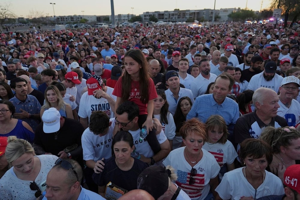 People wait in line before a memorial for conservative activist Charlie Kirk Sunday, September 21, 2025, at State Farm Stadium in Glendale, Ariz. (AP Photo/Jae C. Hong)