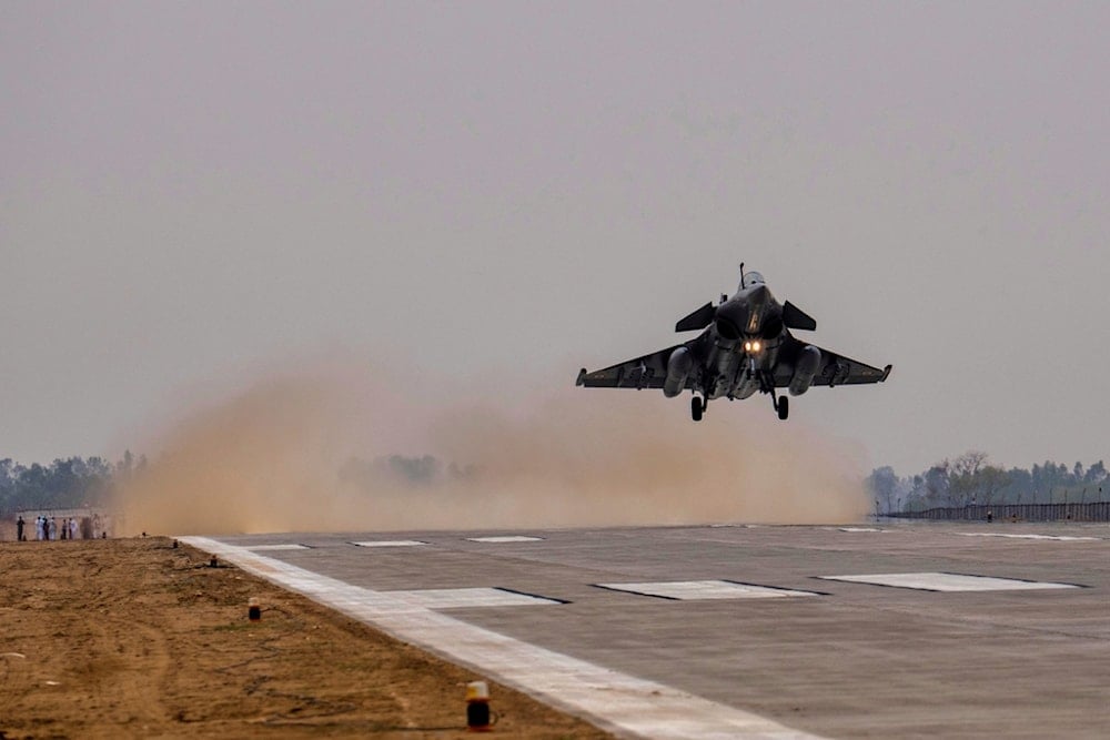 An Indian Air Force fighter jet performs touch and go landings as part of a preparedness exercise to use highways as landing strips for emergencies near Prayagraj, Uttar Pradesh, India, Friday, May 2, 2025. (AP Photo/Rajesh Kumar Singh)