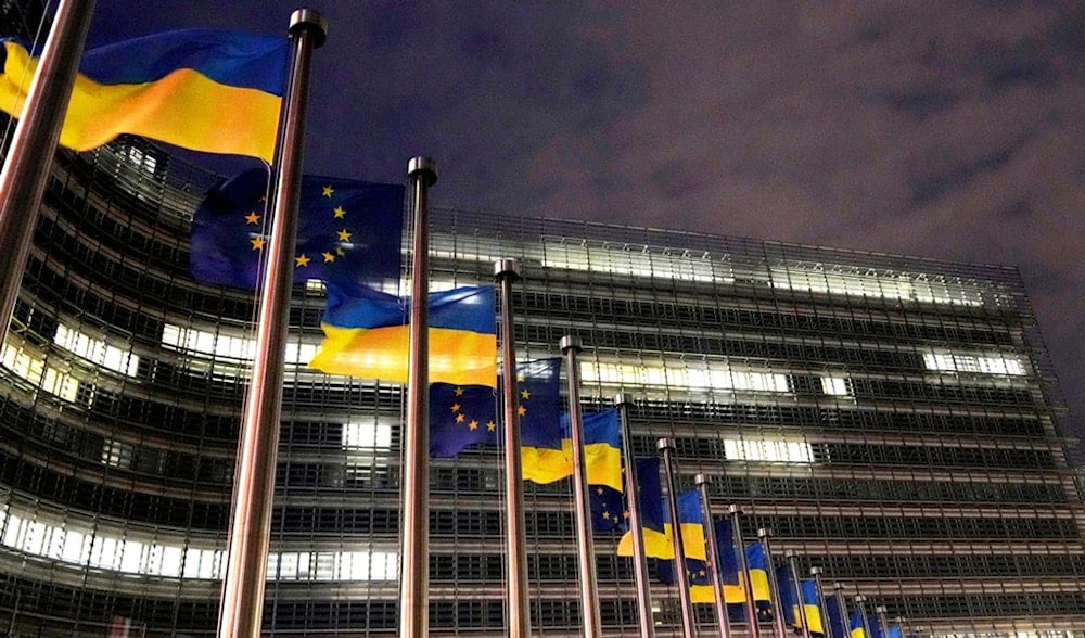 The European Union and Ukrainian flags flap in the wind to mark the third anniversary of Russia's full-scale invasion of Ukraine outside EU headquarters in Brussels, Monday, Feb. 24, 2025. (AP)