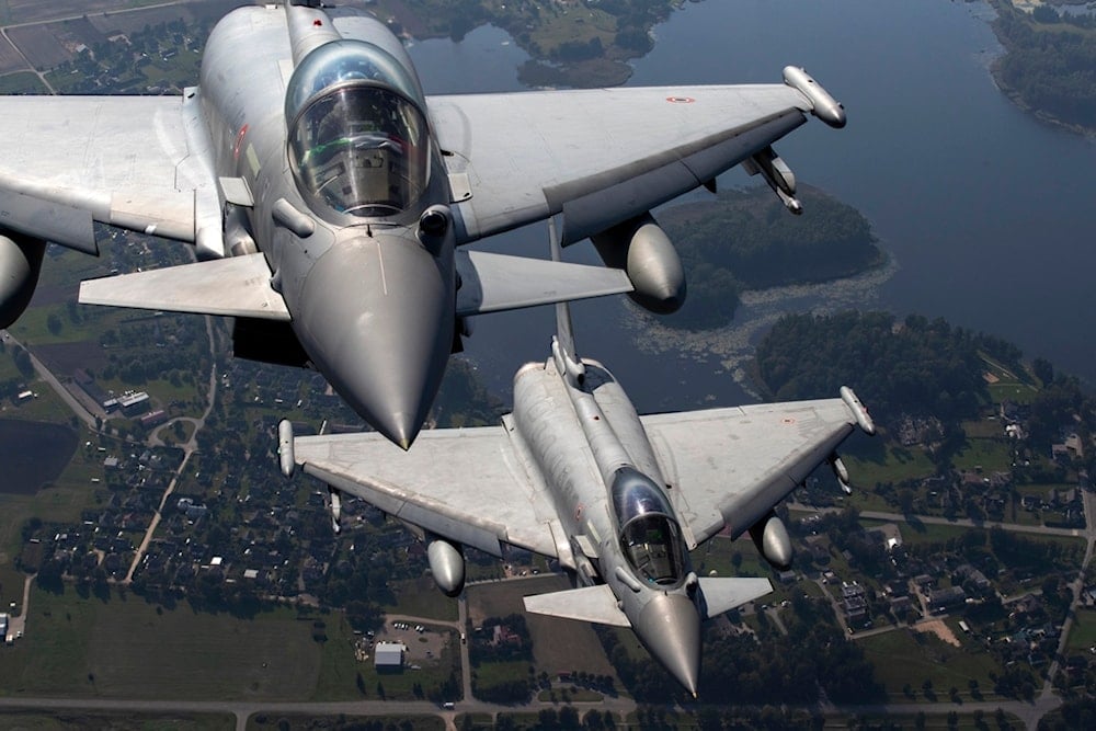  Italian Air Force Eurofighter Typhoon military fighter jets participate in NATO's Baltic Air Policing Mission operate in Lithuanian airspace, on Sept.12, 2023. (AP Photo/Mindaugas Kulbis, File)
