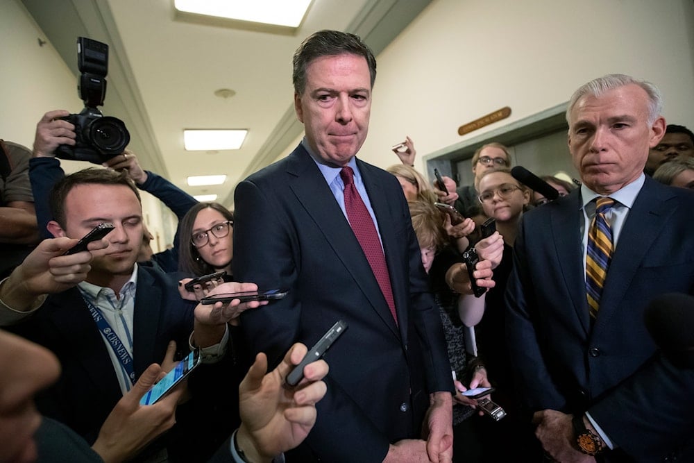 Former FBI Director James Comey, with his attorney, David Kelley, right, speaks to reporters after a day of testimony before the House Judiciary and Oversight committees, on Capitol Hill in Washington, Friday, Dec. 7, 2018 (AP)
