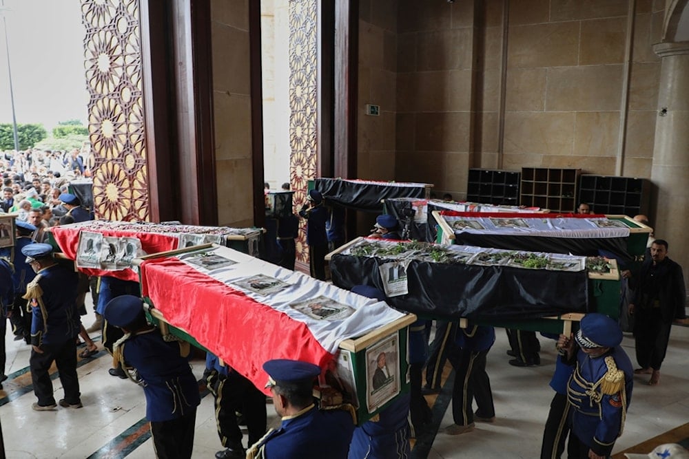 Yemeni honor guards carry the coffins of 31 local journalists reportedly killed in Israeli airstrikes last week, out of the Shaab Mosque during their funeral in Sanaa, Yemen, Tuesday, September 16, 2025 (AP) 