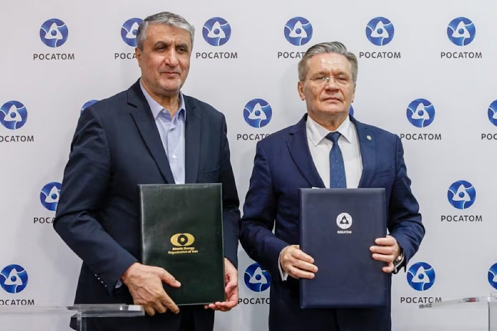 Alexei Likhachev, General Director of Rosatom, meets with the head of the Iranian Atomic agency Mohammad Eslami in Moscow, September 26, 2025 (AFP)