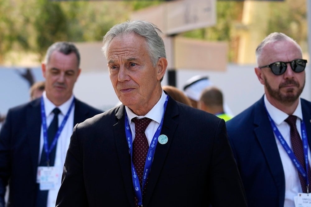 Britain's former Prime Minister Tony Blair walks through the COP28 UN Climate Summit, Sunday, December 3, 2023, in Dubai, United Arab Emirates (AP)