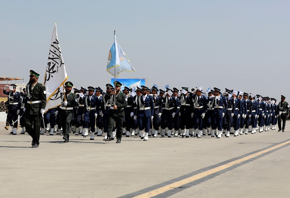 Taliban security personnel march during a military parade to mark the third anniversary of the withdrawal of U.S.-led troops from Afghanistan, in Bagram Air Base in the Parwan Province of Afghanistan, Wednesday, Aug. 14, 2024 (AP)