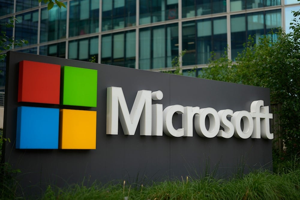 The logo of Microsoft is seen outside it's French headquarters in Issy-les-Moulineaux, outside Paris, Monday, May 13, 2024 (AP)