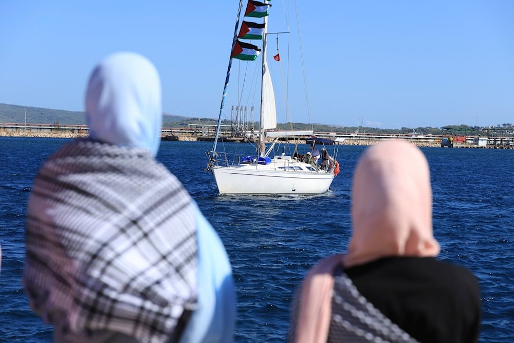 Supporters watch as a boat that is part of the Global Sumud Flotilla departs to Gaza to deliver aid amidst Israel's blockade on the Palestinian territory, in the Tunisian port of Bizerte, Saturday, Sept. 13, 2025 (AP)