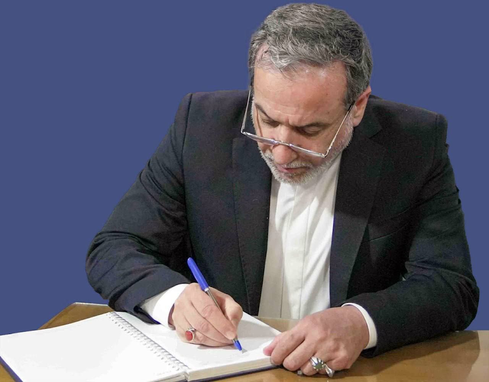 Undated photo of Iranian Foreign Minister Abbas Aragchi drafting a letter (Iranian media)