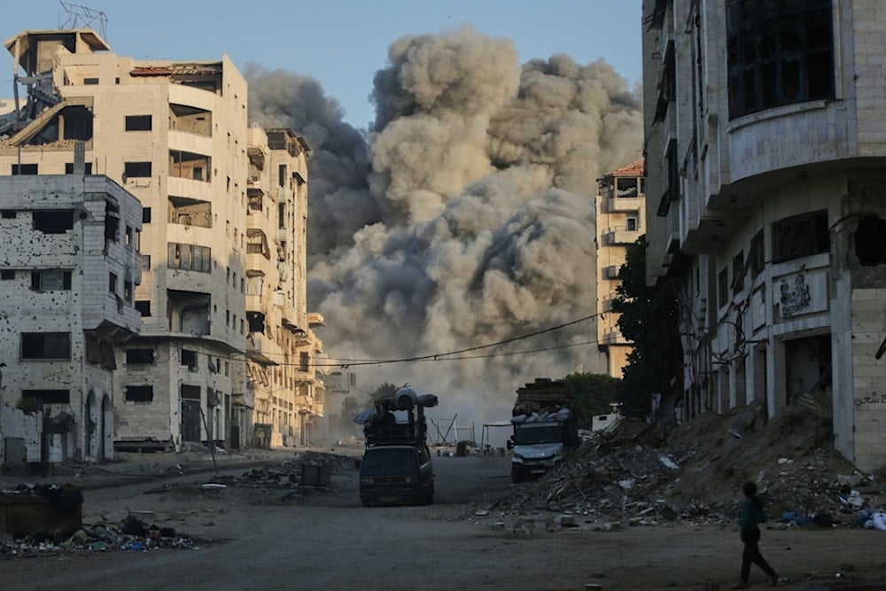 Smoke rises from an Israeli airstrike on the Macca Tower, a high-rise building in Gaza City, Sunday, September 28, 2025, following a prior warning issued by the Israeli army. (AP Photo/Yousef Al Zanoun)