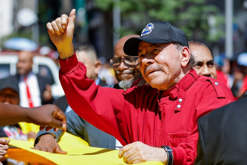 Nicaragua's President Daniel Ortega gestures to government supporters after attending the swearing-in ceremony of Venezuelan President Nicolas Maduro for a third term at the National Assembly in Caracas, Venezuela, Friday, Jan. 10, 2025 (AP)